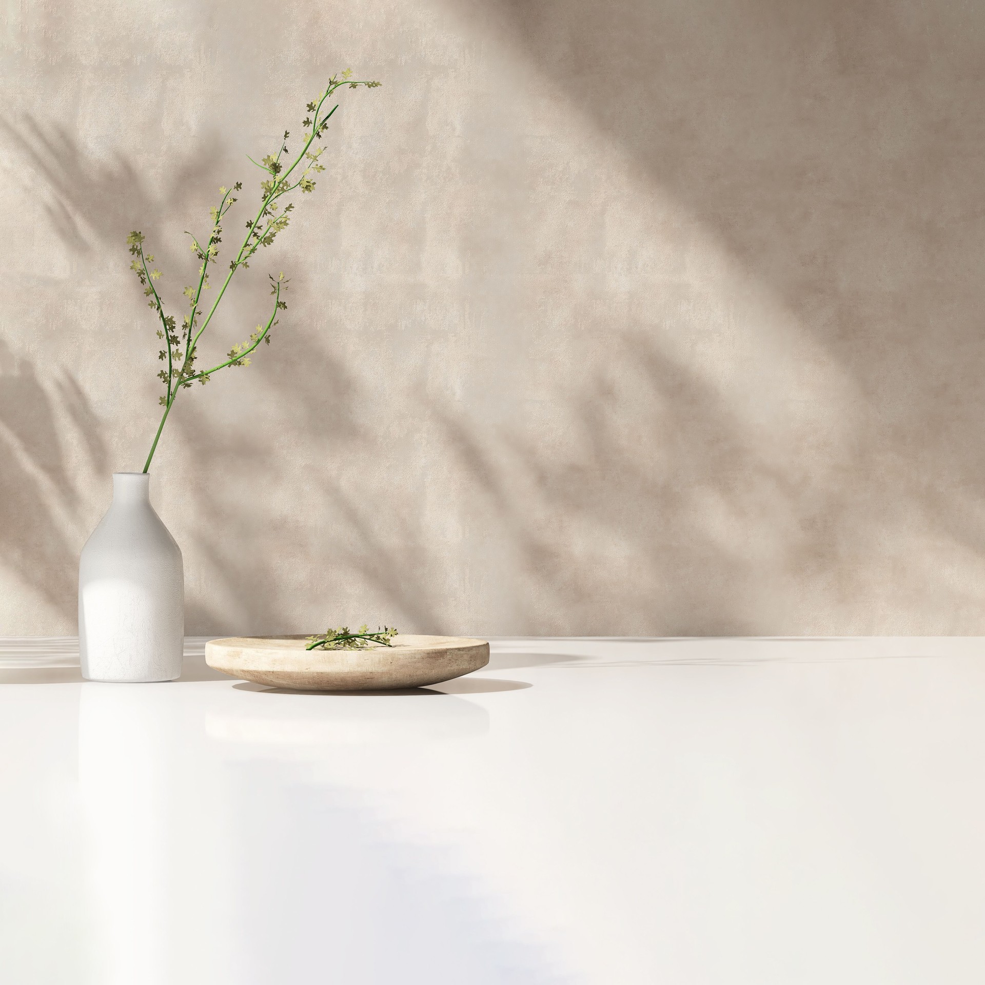 Modern white vase with green plant, wooden plate on stone counter table with space in sunlight, leaf shadow on beige stucco cement wall