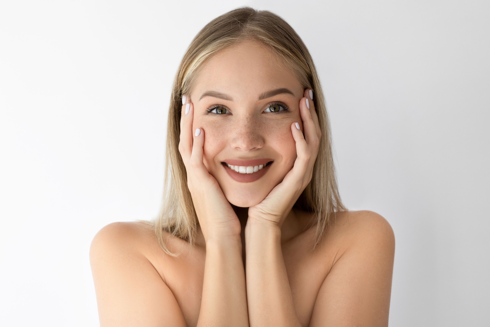 Beautiful female smiling with hand on chin