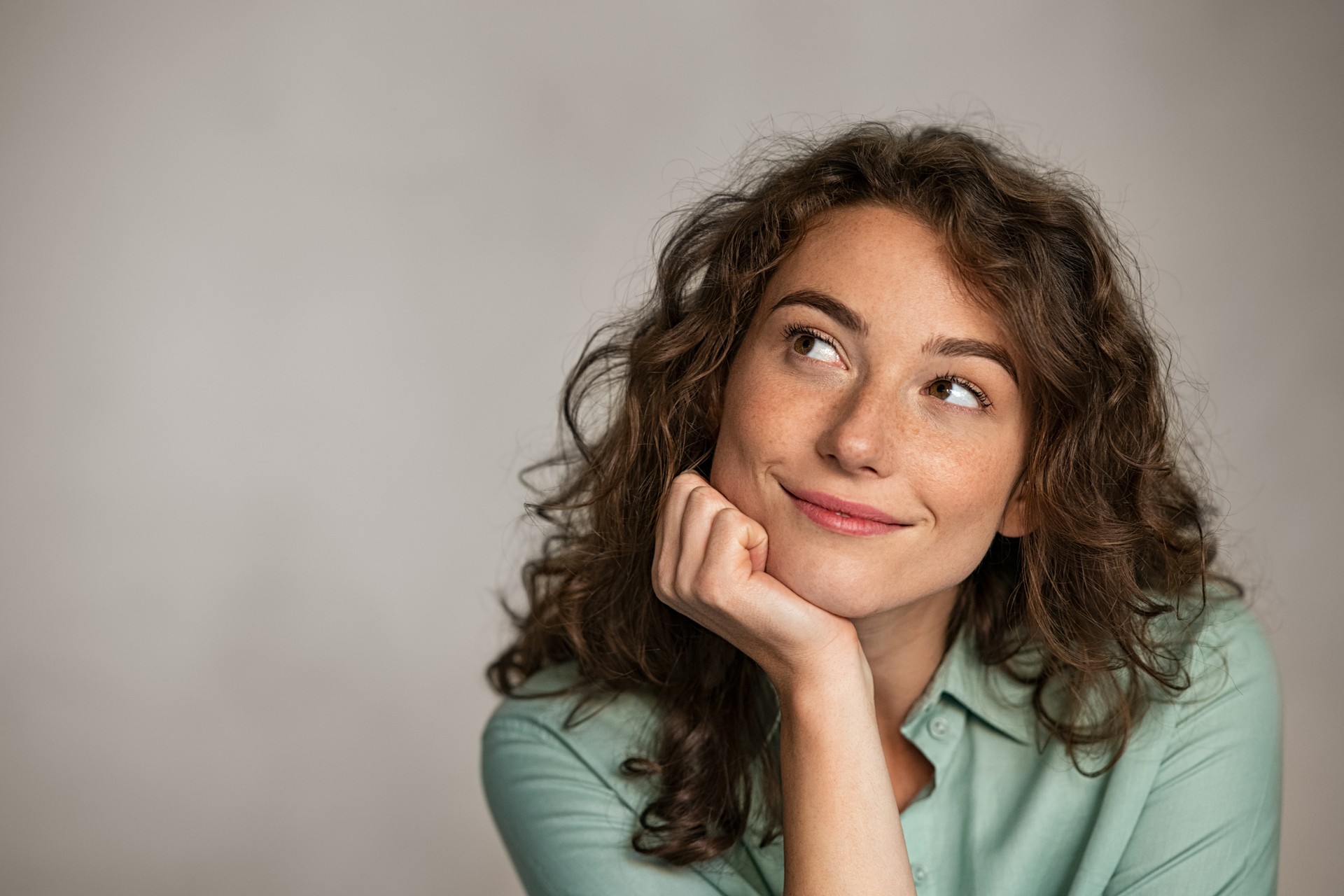 Positive young woman thinking